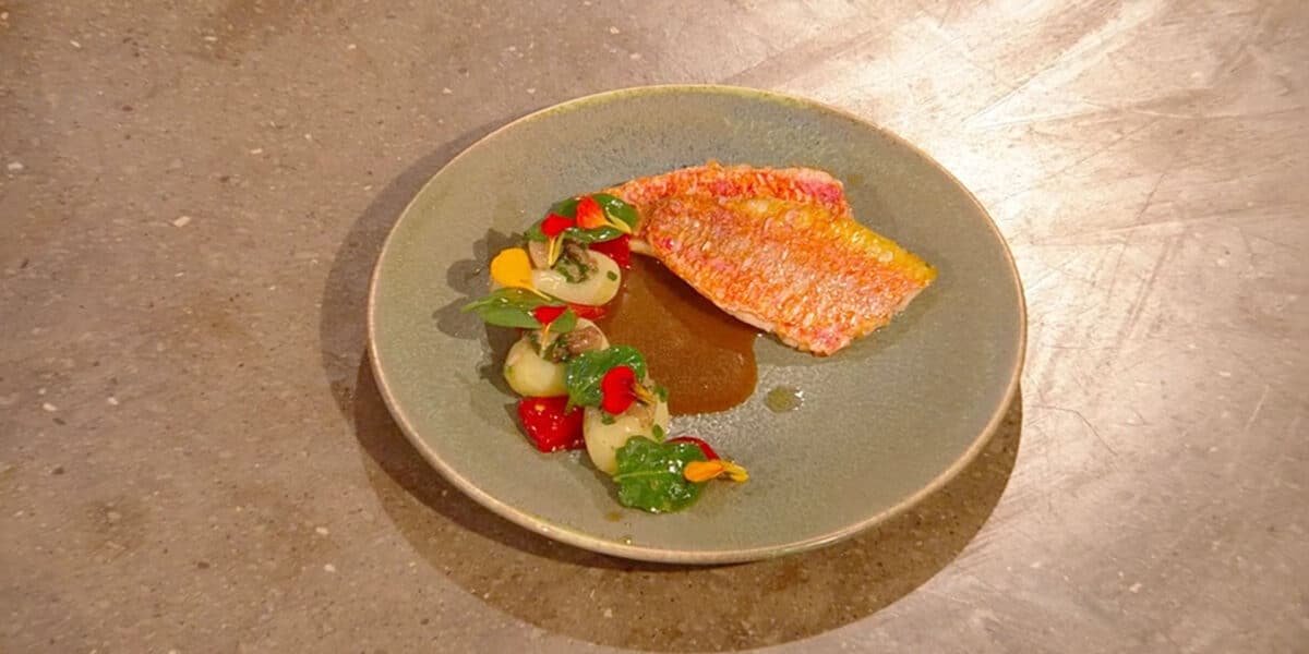 Edible nasturtium flowers used to add spicy flavour to a fish dish