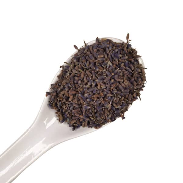 dried lavender petals edible flowers on a white spoon